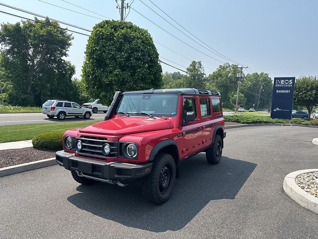 2025 INEOS Grenadier Station Wagon Trialmaster Edition in Devil Red — front three-quarter view