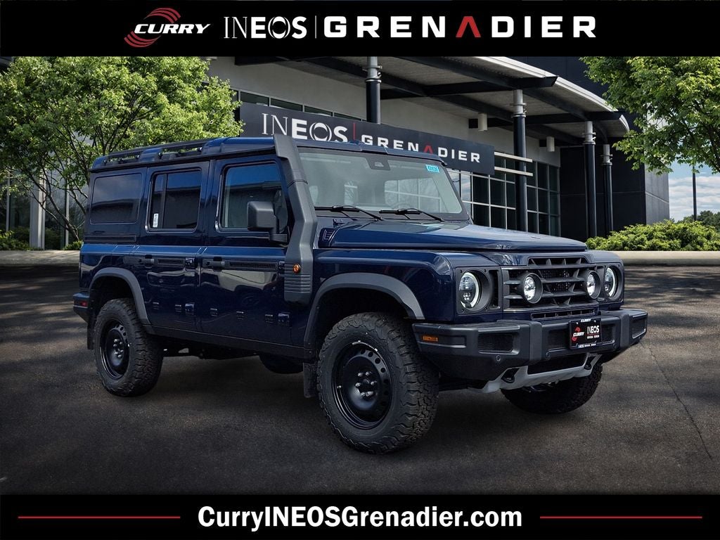 2026 INEOS Grenadier Station Wagon Trialmaster Edition in Britannia Blue — front three-quarter view