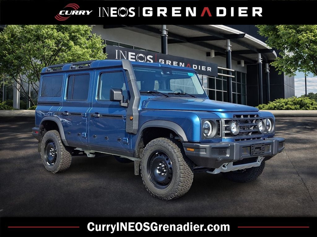 2026 INEOS Grenadier Station Wagon Trialmaster Edition in Shale Blue Metallic — front three-quarter view